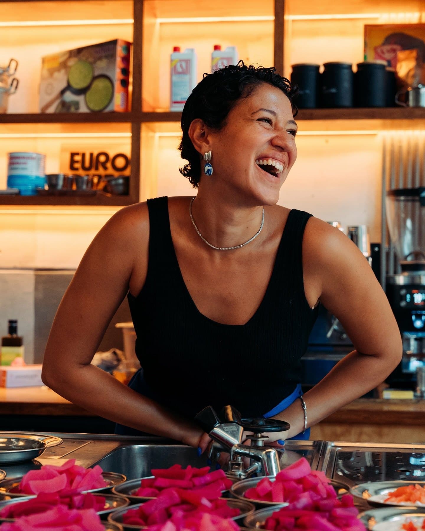 A Sanaa's Kitchen collaborator preparing food