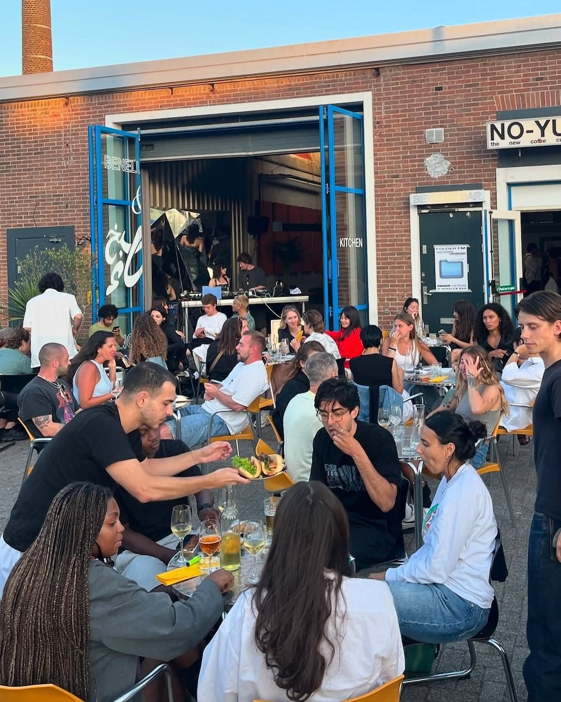 Guests eating outside at a Sanaa's Kitchen terrace pop-up